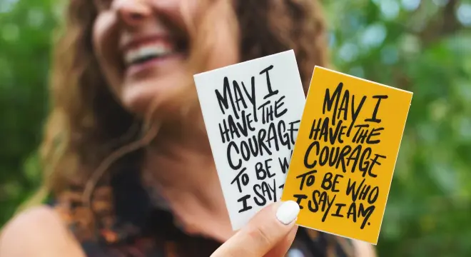 washing custom square stickers on a water bottle